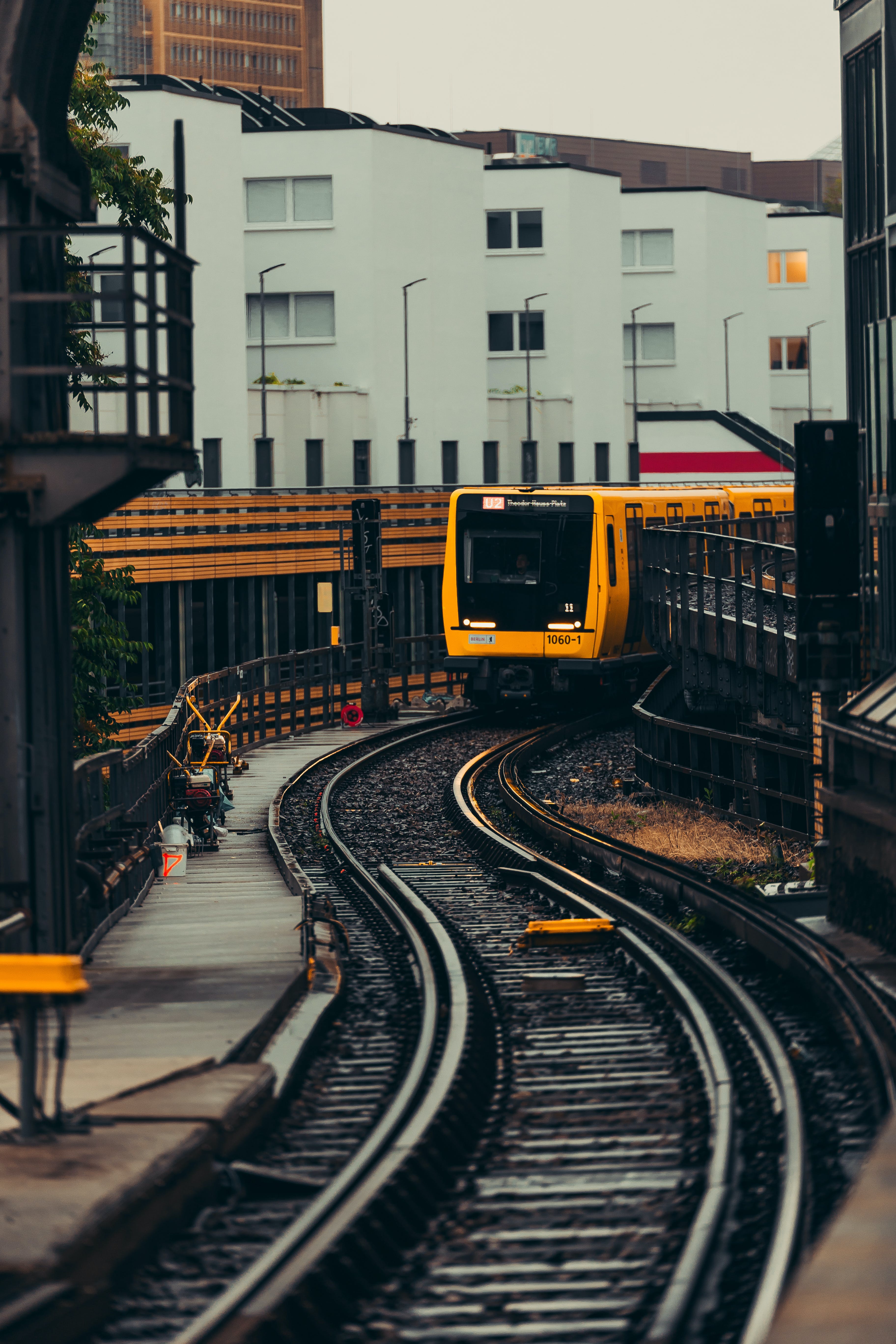 Train on a track near buildings