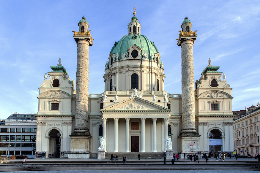 The St. Charles Church in Vienna, a baroque building containing a dome and two columns.